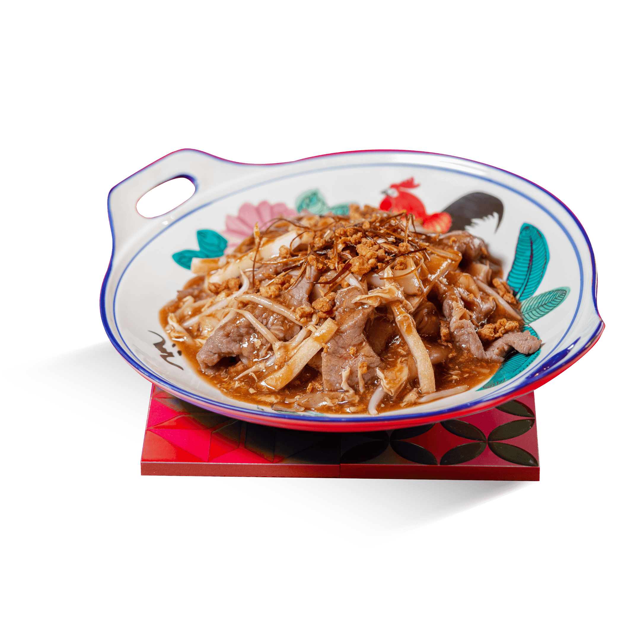 Beef Hor Fun served on a patterned plate.