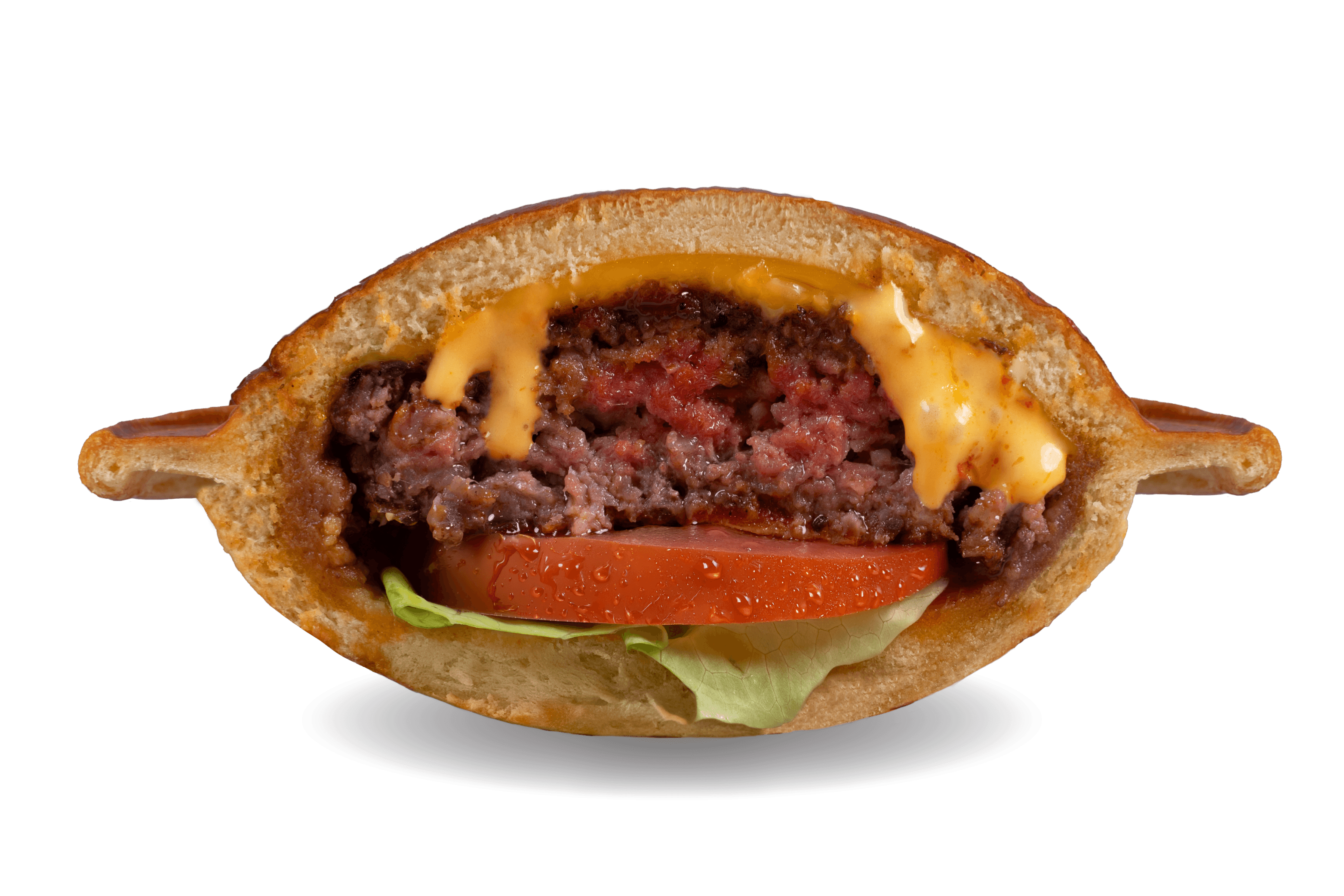 Beam Me Up UFO Burger, cut open to show the beef patty, cheese, tomato and lettuce.