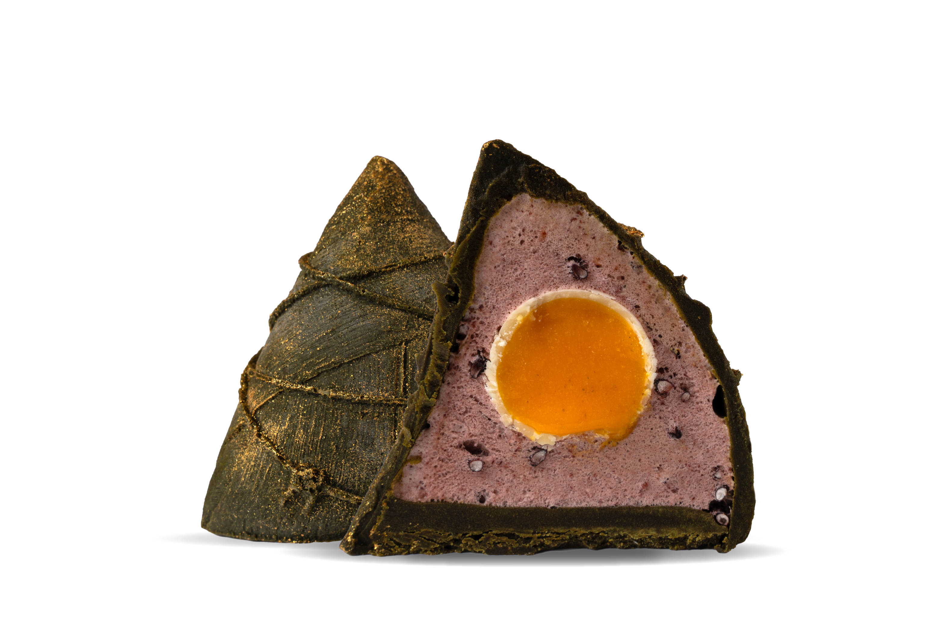 20260504_SW_DBF_Website_Pulut Hitam Two triangular mooncakes: dark green crust dusted with gold, one half revealing purple lotus paste with a bright orange salted egg yolk inside.